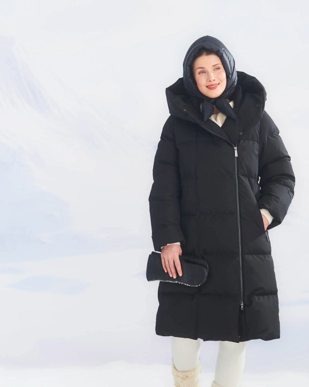Black (color: Black onyx) Lovisa down coat is a long model with wide horizontal quilting, a front zipper, and a large hood.