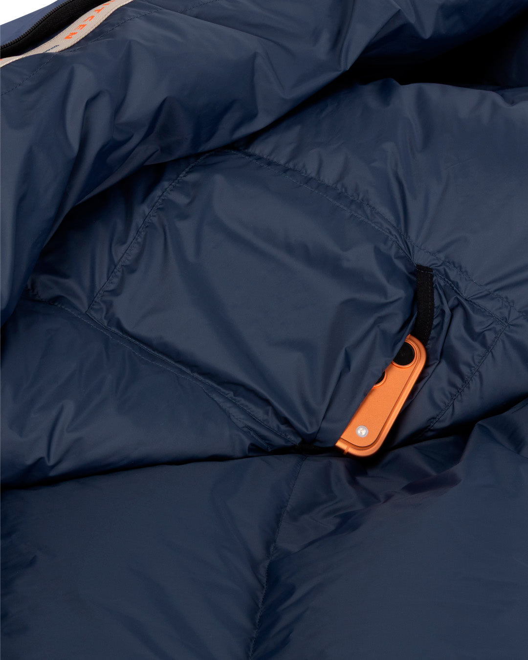 Close-up of a navy down sleeping bag.