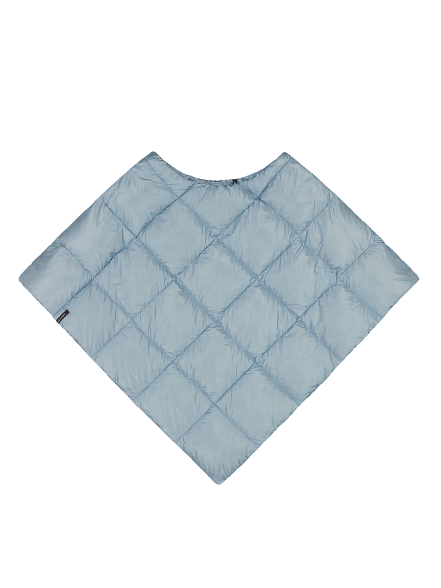 Ice blue (color: Blue butterfly), diamond-quilted Unelma down poncho. The poncho has a round neckline and flares out from the shoulders downwards, creating an angular silhouette. A small black brand label is located on the left edge.